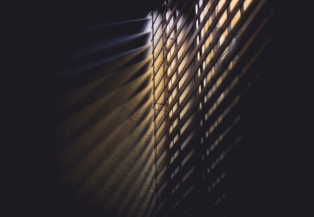 Low Light Photography of Brown Window Blinds