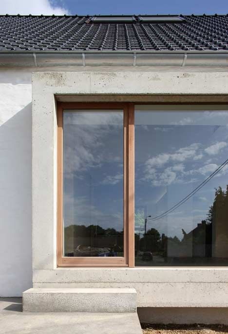 Modern concrete and wood window frame on contemporary house.